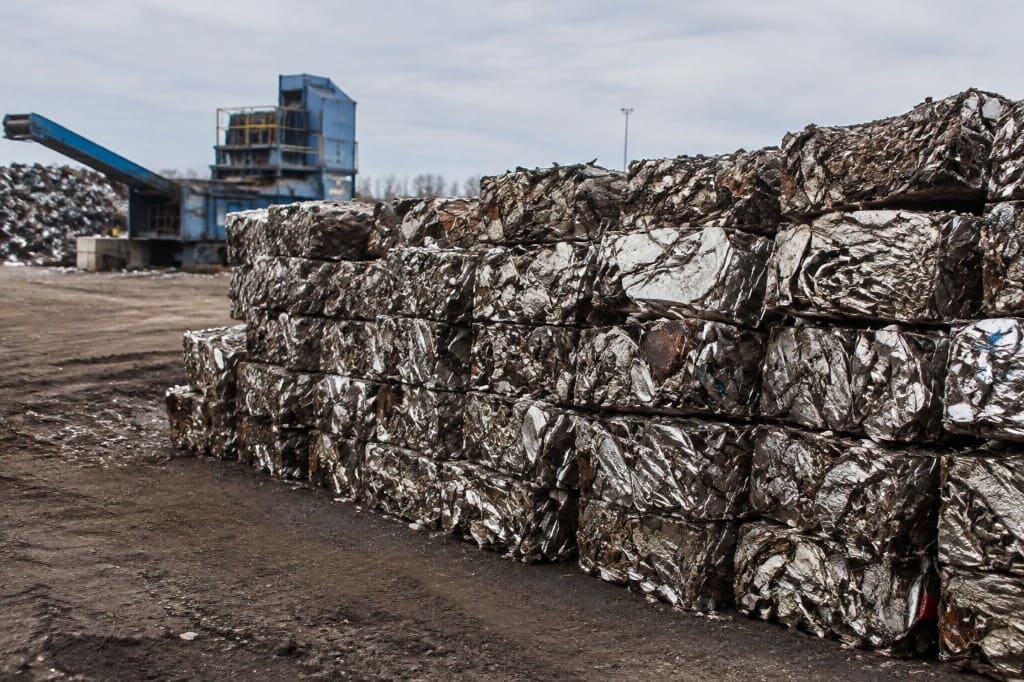 Compacted iron bales neatly stacked in the yard